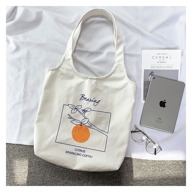 Stylish One-Shoulder Canvas Bag Featuring Vibrant Orange Fruit Print