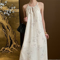 Sure! Here is an optimized title for your clothing product in English:

"Bamboo Fringed Hem Halterneck Maxi