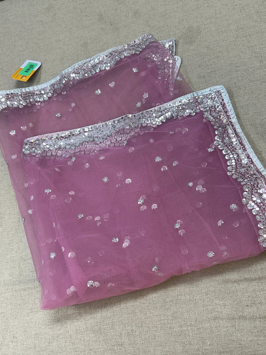 Light pink net dupatta with silver sequin border