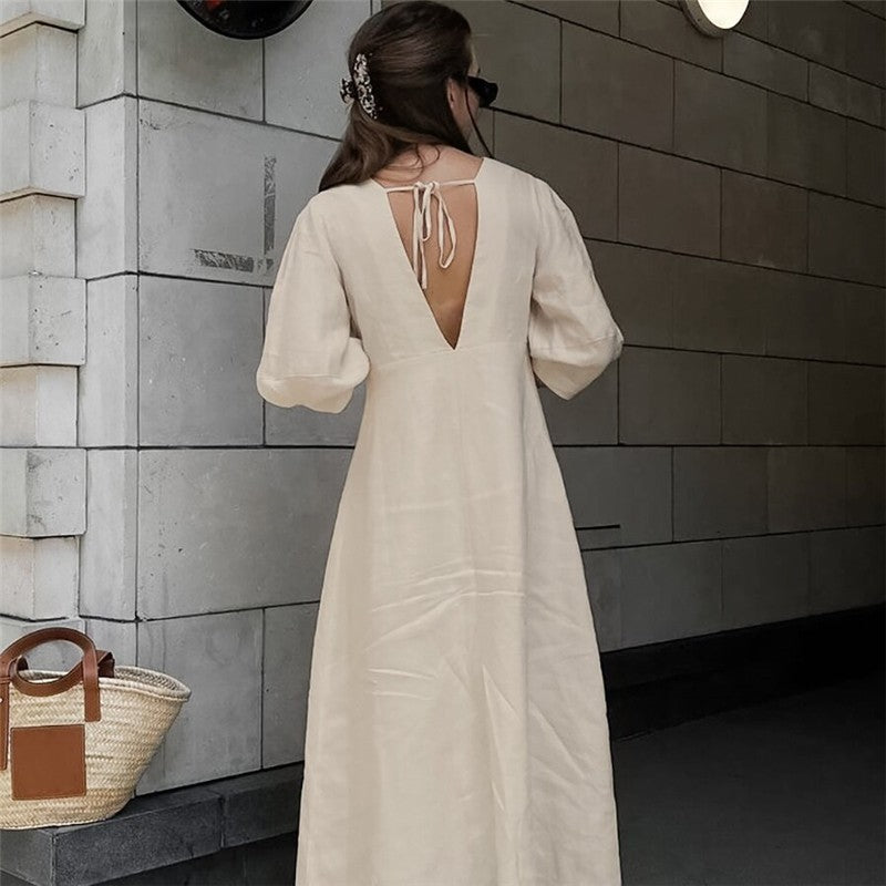 Sure! Here is an optimized title for your clothing product in English:

"Chic V-Neck Dress with Backless