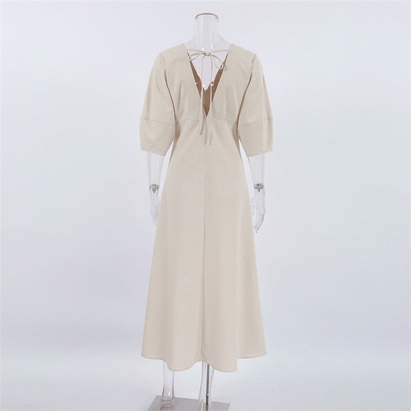 Sure! Here is an optimized title for your clothing product in English:

"Chic V-Neck Dress with Backless