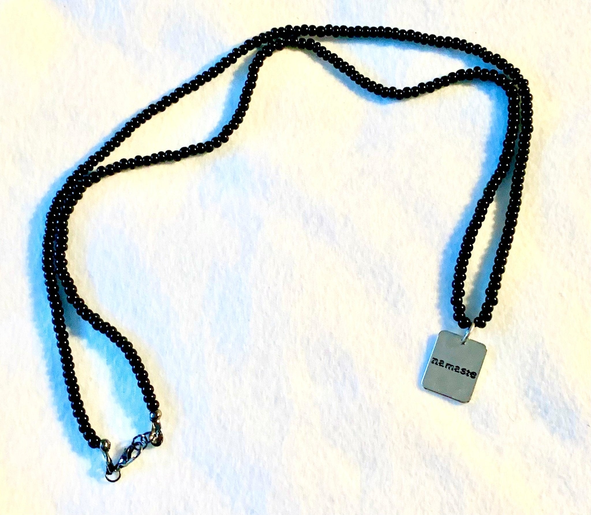 Namaste Handmade Long 30" Black Glass Beaded Necklace (Namaste Charm Pendant)