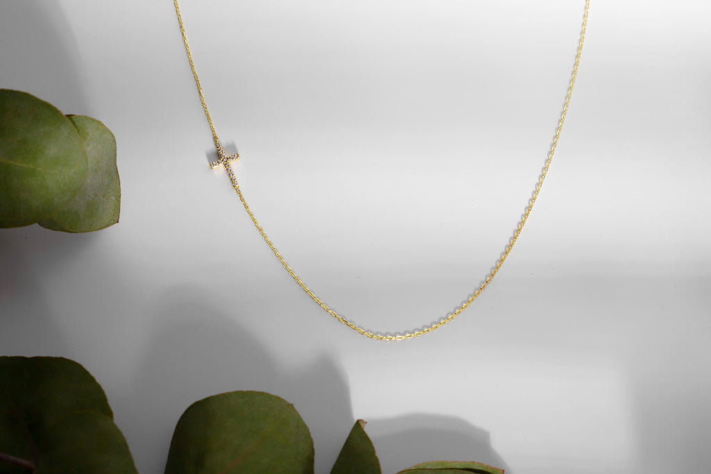 14K Gold Sideways Cross Necklace with Sparkling CZ Diamonds