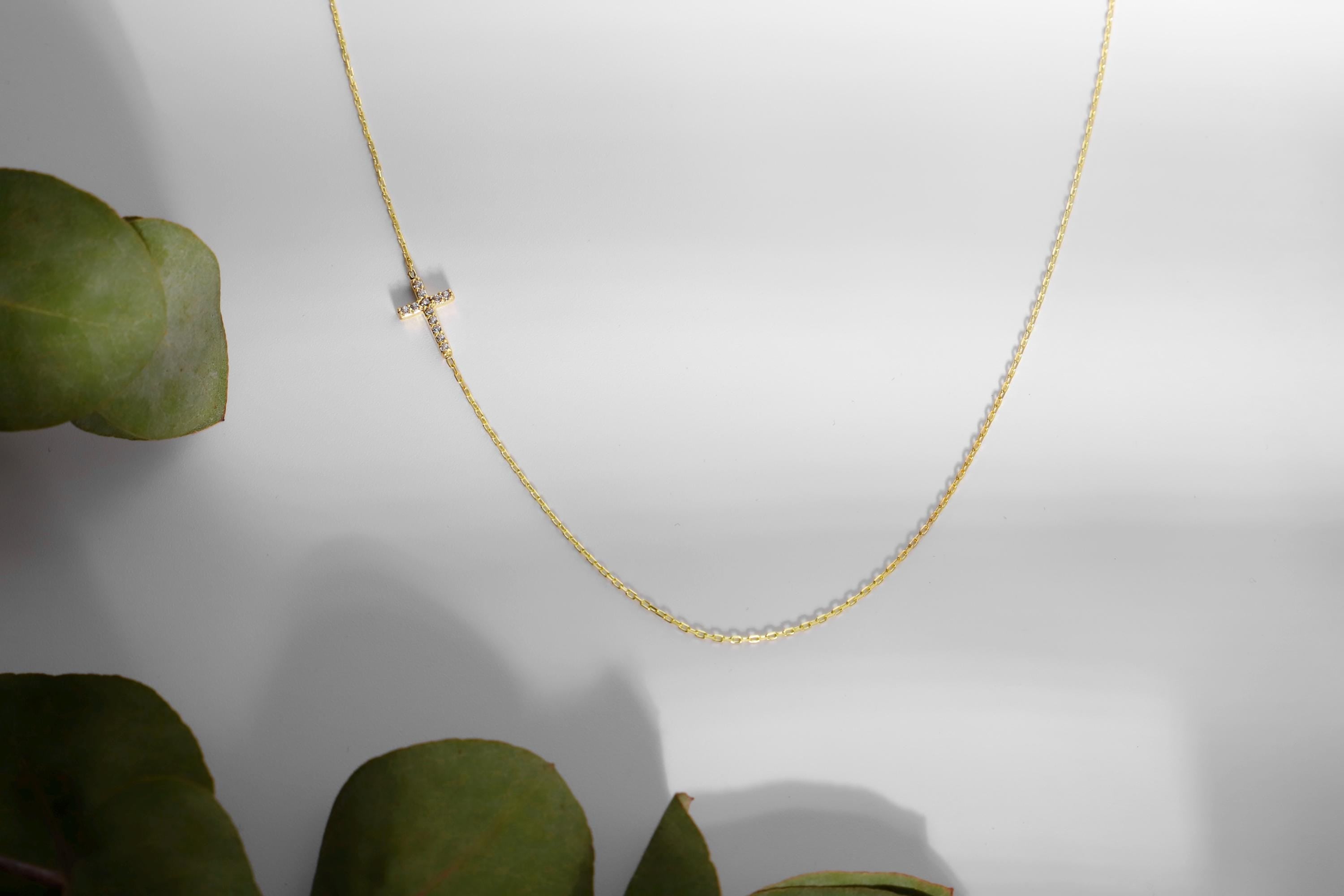 14K Gold Sideways Cross Necklace with Sparkling CZ Diamonds