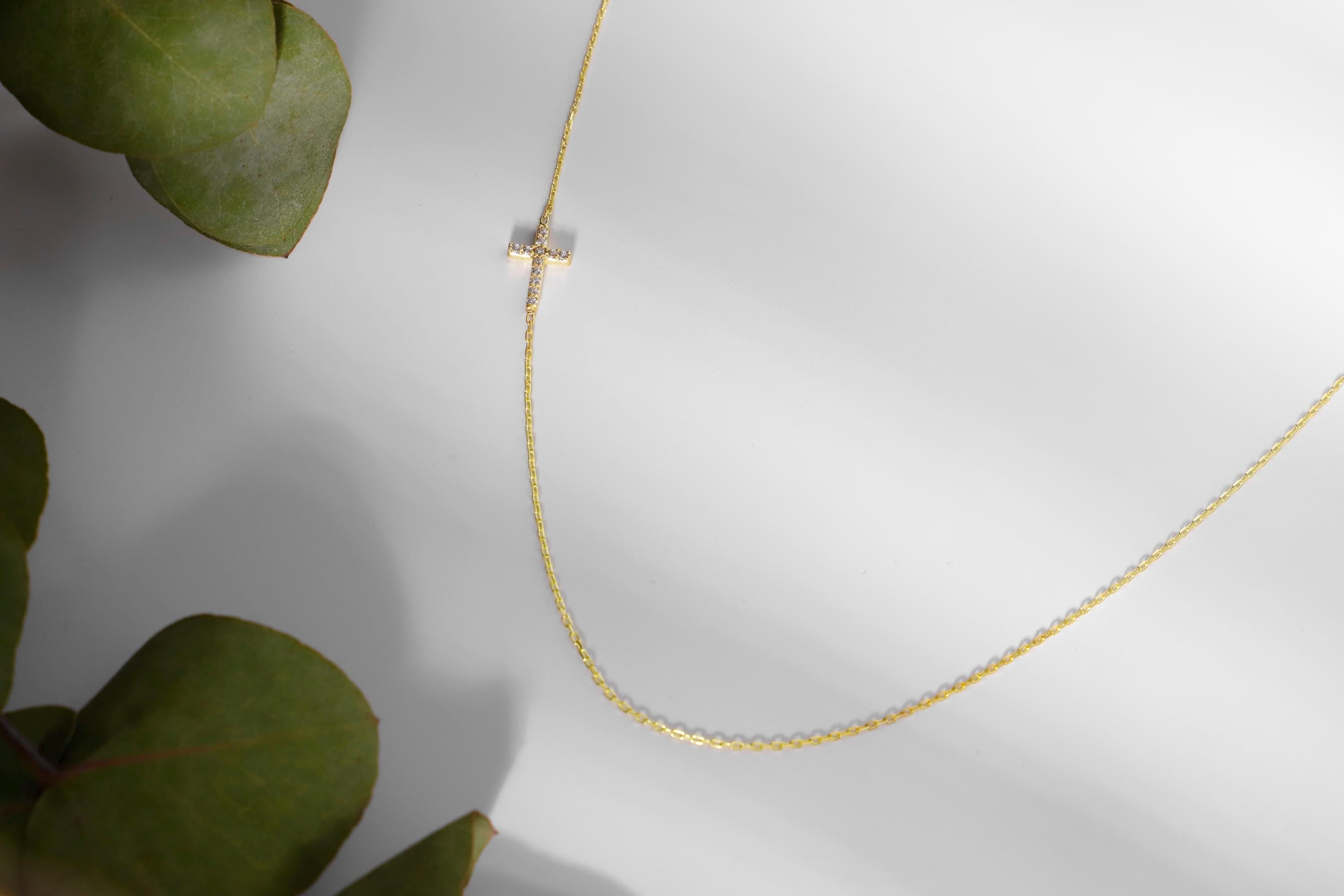 14K Gold Sideways Cross Necklace with Sparkling CZ Diamonds