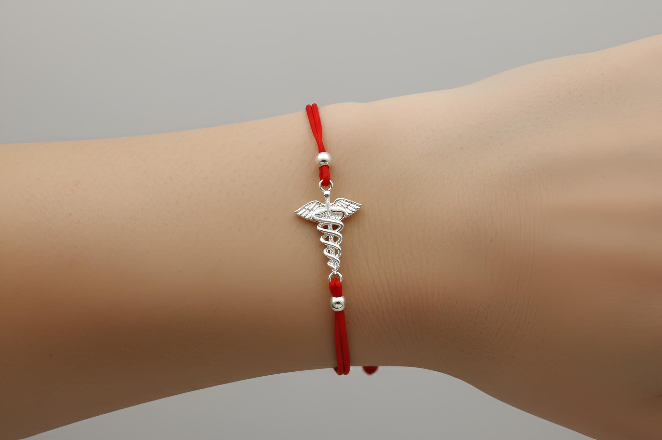 Nurse's Pride Sterling Silver Caduceus Bracelet - A Tribute to Compassionate Care